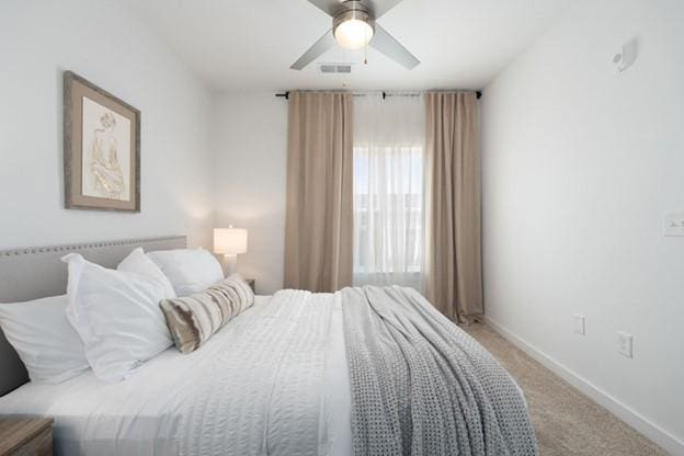 carpeted bedroom with ceiling fan