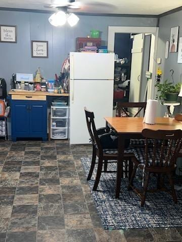 dining space featuring crown molding