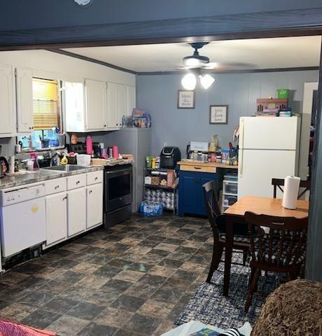 kitchen with white cabinetry, sink, white appliances, and ceiling fan