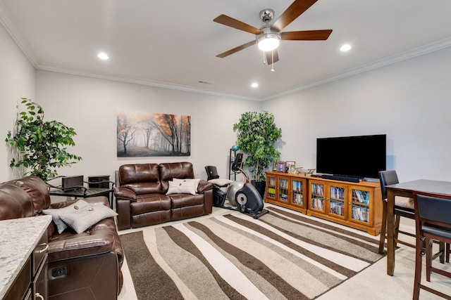 carpeted living room featuring ceiling fan and crown molding