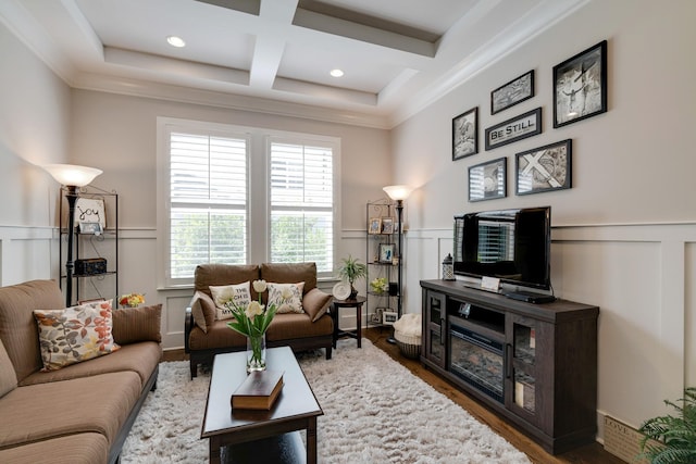 living room featuring beam ceiling, crown molding, coffered ceiling, and hardwood / wood-style flooring