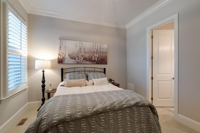 bedroom featuring light colored carpet and ornamental molding