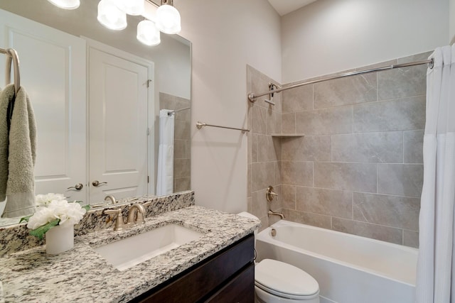 full bathroom with toilet, vanity, and shower / tub combo