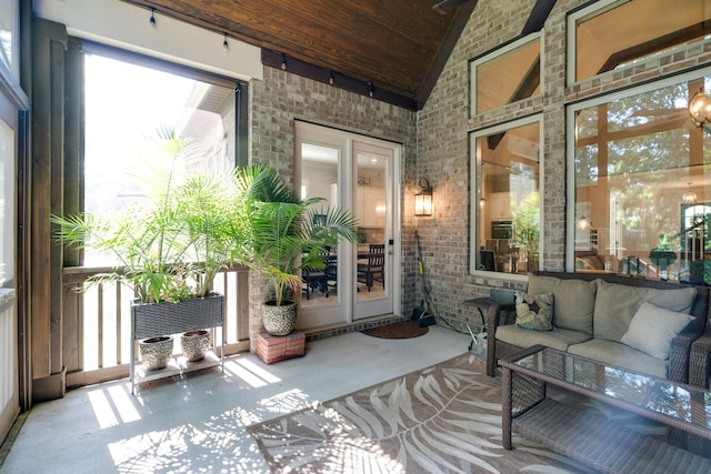 sunroom with vaulted ceiling