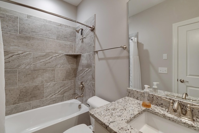 full bathroom featuring toilet, shower / tub combo, and vanity