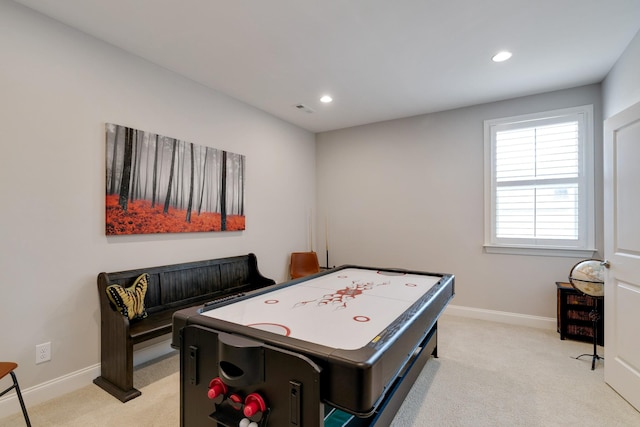 game room featuring light carpet