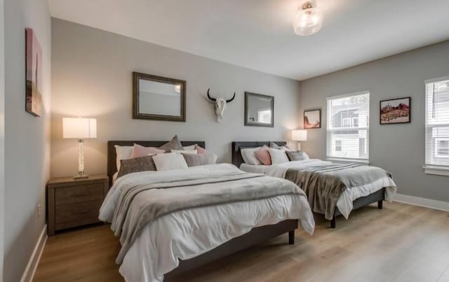 bedroom with light hardwood / wood-style floors