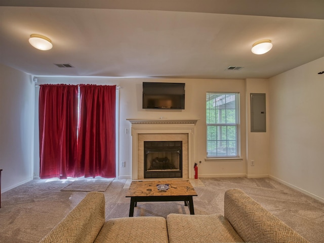 carpeted living room featuring electric panel