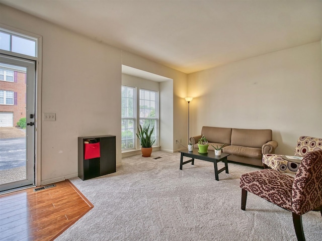 living room with light colored carpet