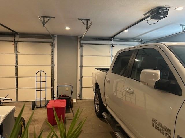 garage featuring a garage door opener