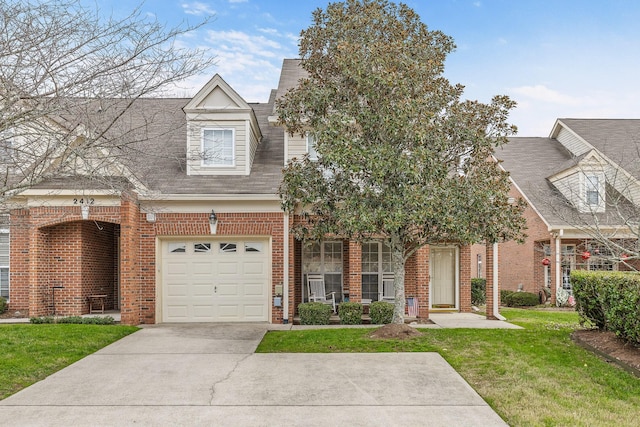 view of front of house featuring a front yard and a garage