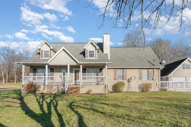 new england style home featuring covered porch and a front yard