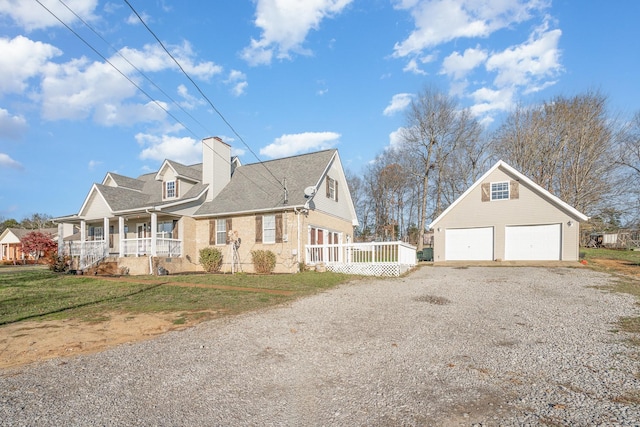 view of side of property with covered porch and a yard