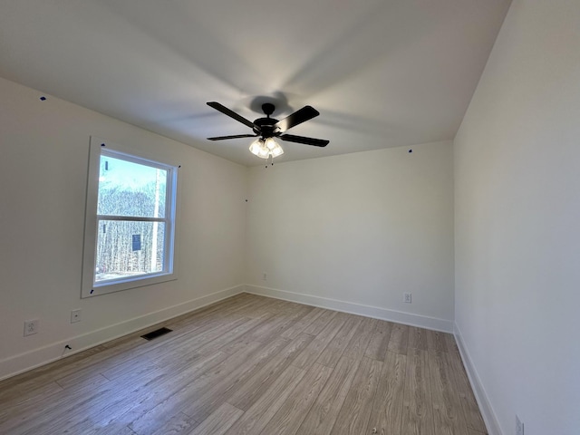 unfurnished room featuring ceiling fan and light hardwood / wood-style flooring