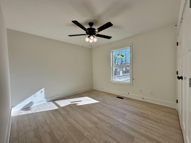 spare room with ceiling fan and light hardwood / wood-style flooring