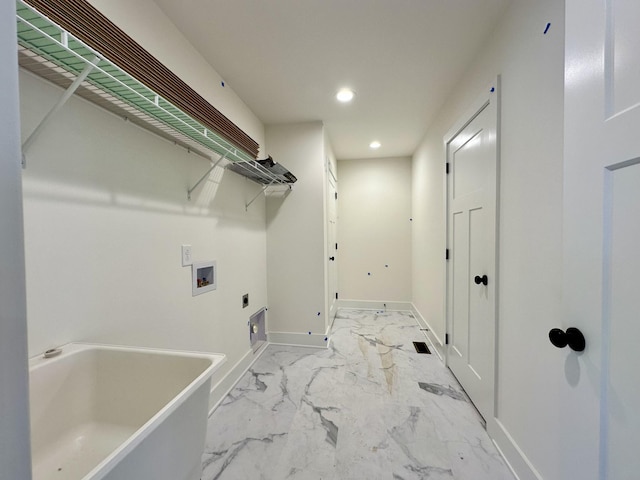 clothes washing area featuring washer hookup and hookup for an electric dryer