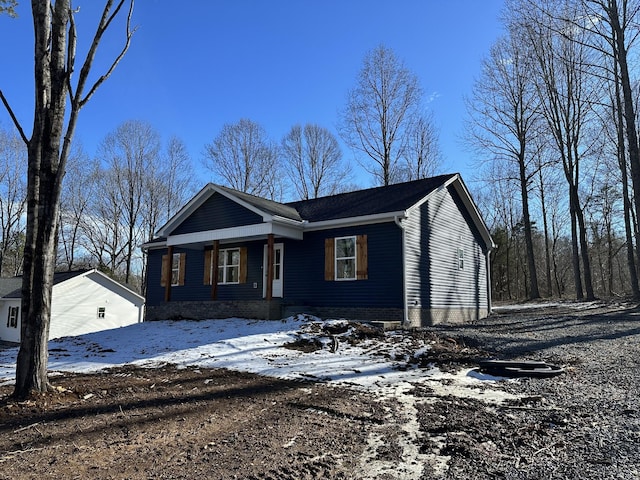 single story home featuring covered porch