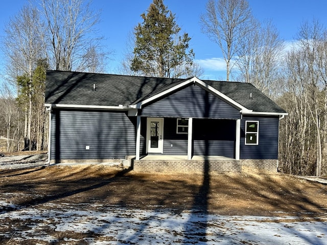 single story home featuring covered porch