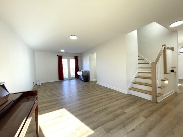 interior space with hardwood / wood-style floors and french doors