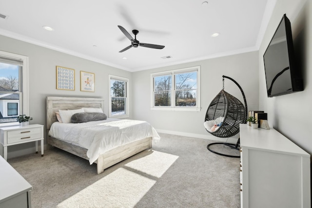 bedroom featuring ceiling fan, light carpet, and crown molding