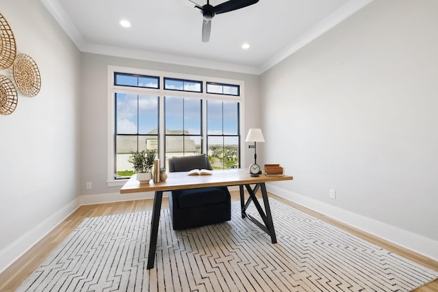 office area with ceiling fan, plenty of natural light, and ornamental molding