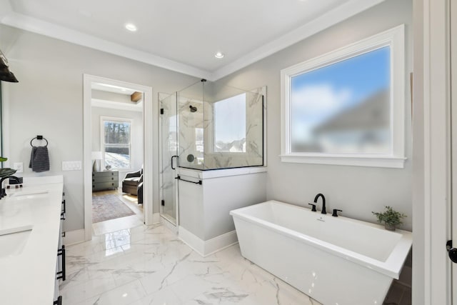 bathroom with vanity, independent shower and bath, and a healthy amount of sunlight