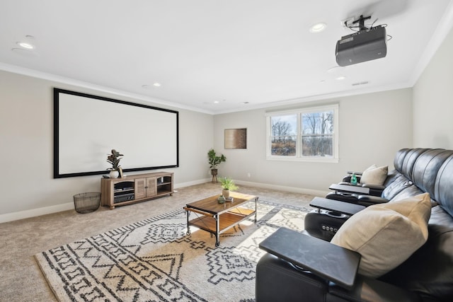 carpeted cinema room featuring crown molding