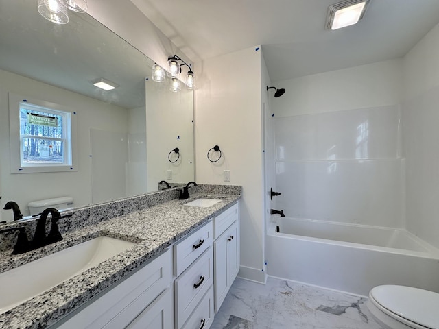 full bathroom featuring toilet, washtub / shower combination, and vanity