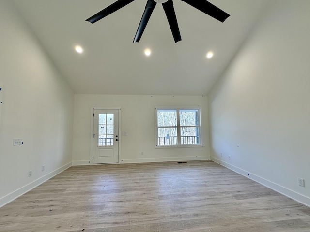 spare room featuring ceiling fan, high vaulted ceiling, and light hardwood / wood-style flooring