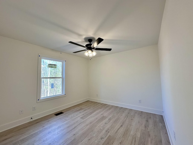 spare room featuring ceiling fan and light wood-type flooring