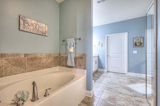 bathroom featuring vanity and a bathing tub