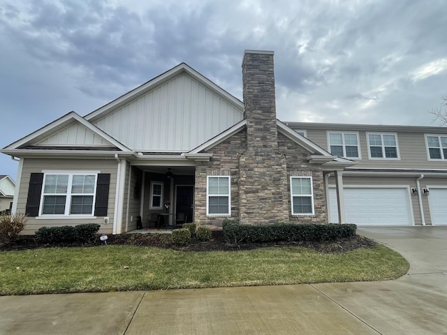 view of front of property featuring a garage and a front yard