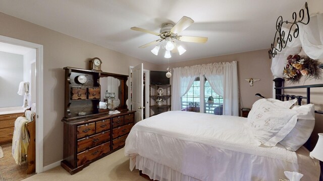 bedroom featuring ceiling fan and light colored carpet