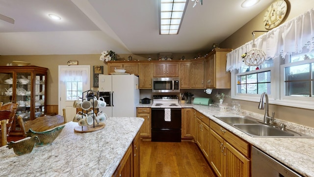 kitchen with electric range oven, dishwashing machine, white fridge with ice dispenser, sink, and dark hardwood / wood-style floors