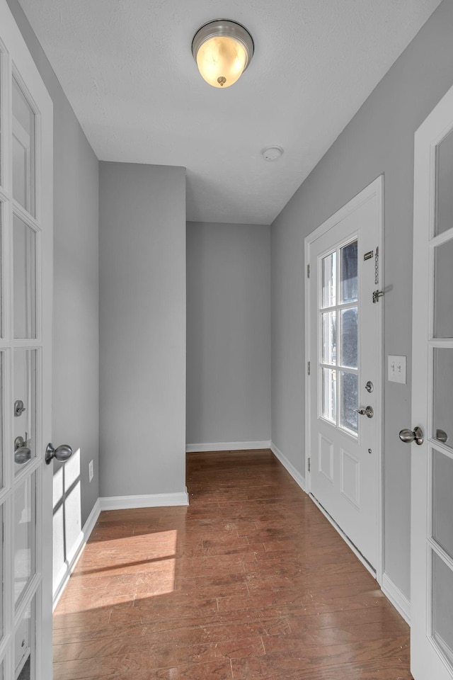 entrance foyer featuring dark hardwood / wood-style floors