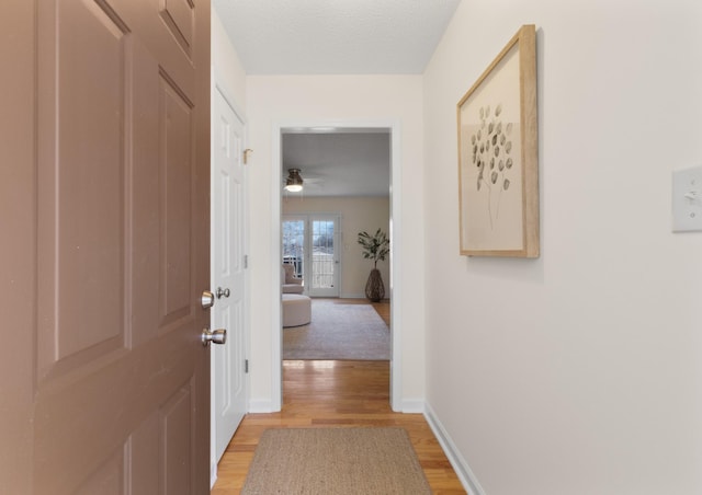 hallway with light wood-type flooring