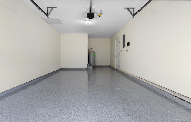 garage featuring water heater, a garage door opener, and electric panel