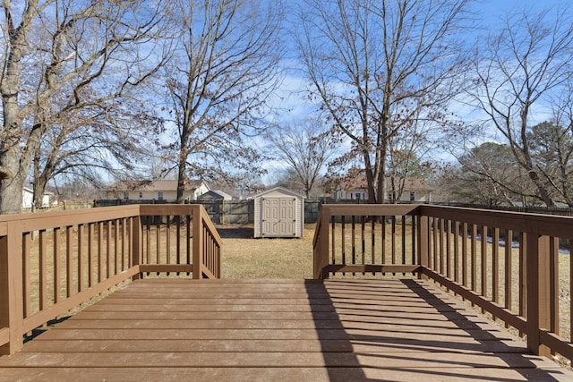 wooden terrace with a storage shed