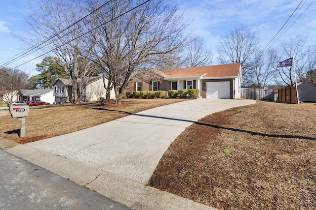 single story home with a garage and a storage shed