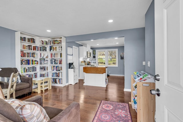 living room with dark hardwood / wood-style flooring