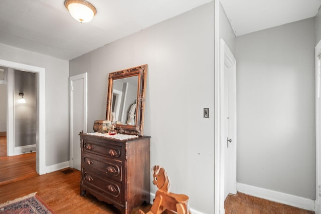 hall with light hardwood / wood-style floors