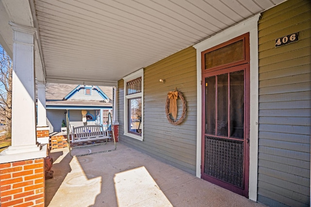 view of patio featuring a porch