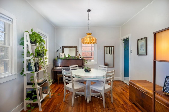 dining area featuring dark hardwood / wood-style floors