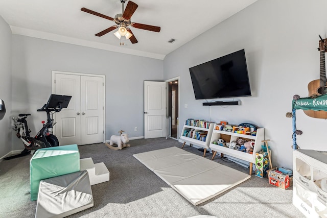 playroom featuring ceiling fan, lofted ceiling, and carpet flooring