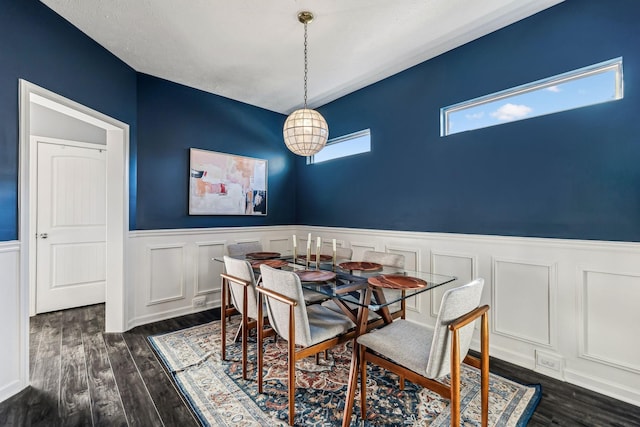 dining area with dark hardwood / wood-style floors