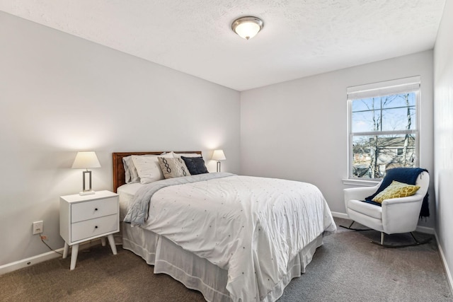 carpeted bedroom featuring a textured ceiling