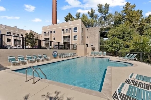 view of swimming pool featuring a patio area