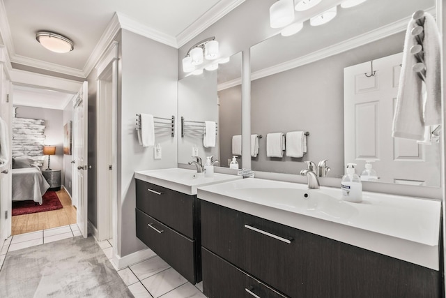 bathroom featuring vanity, tile patterned flooring, and ornamental molding