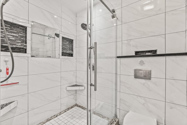 bathroom with tiled shower