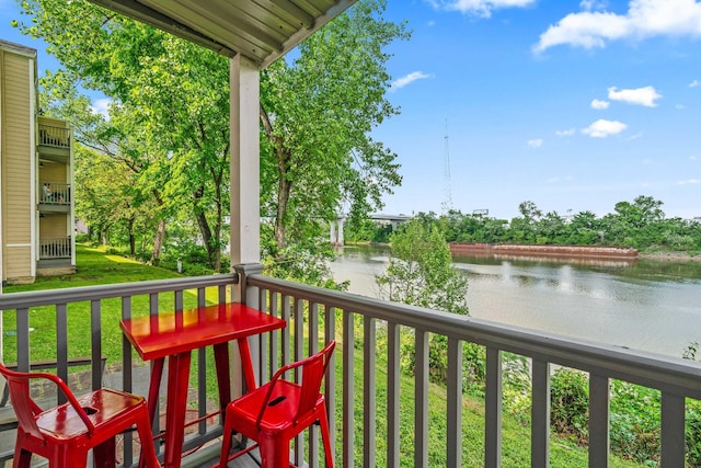 balcony featuring a water view